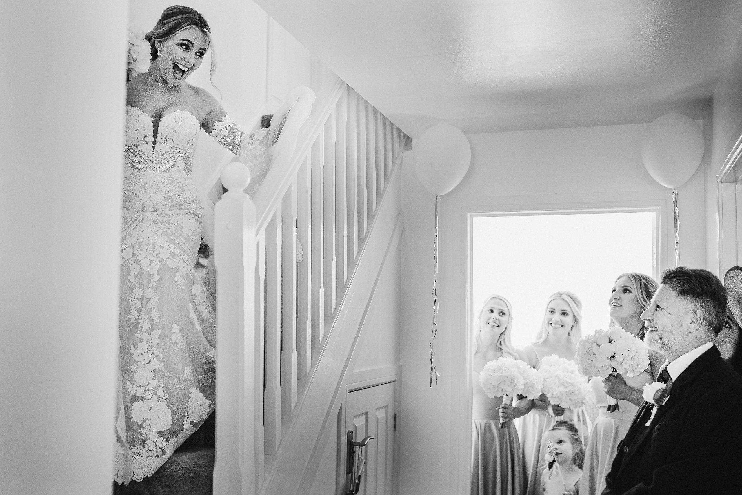Bride walking down the stairs for a first look