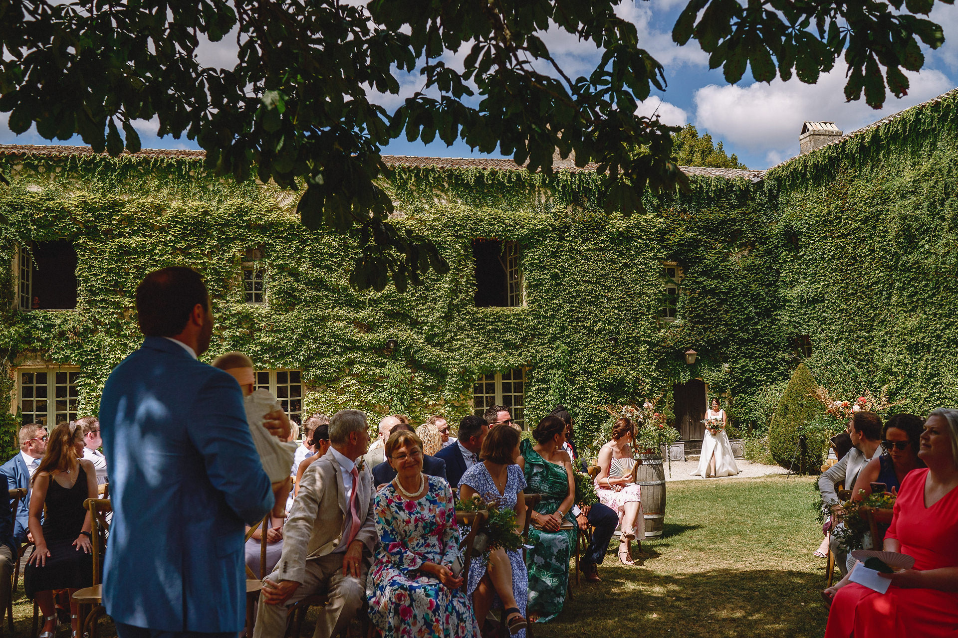 bride walking down the aisle outdoor ceremony Chateau Rigaud