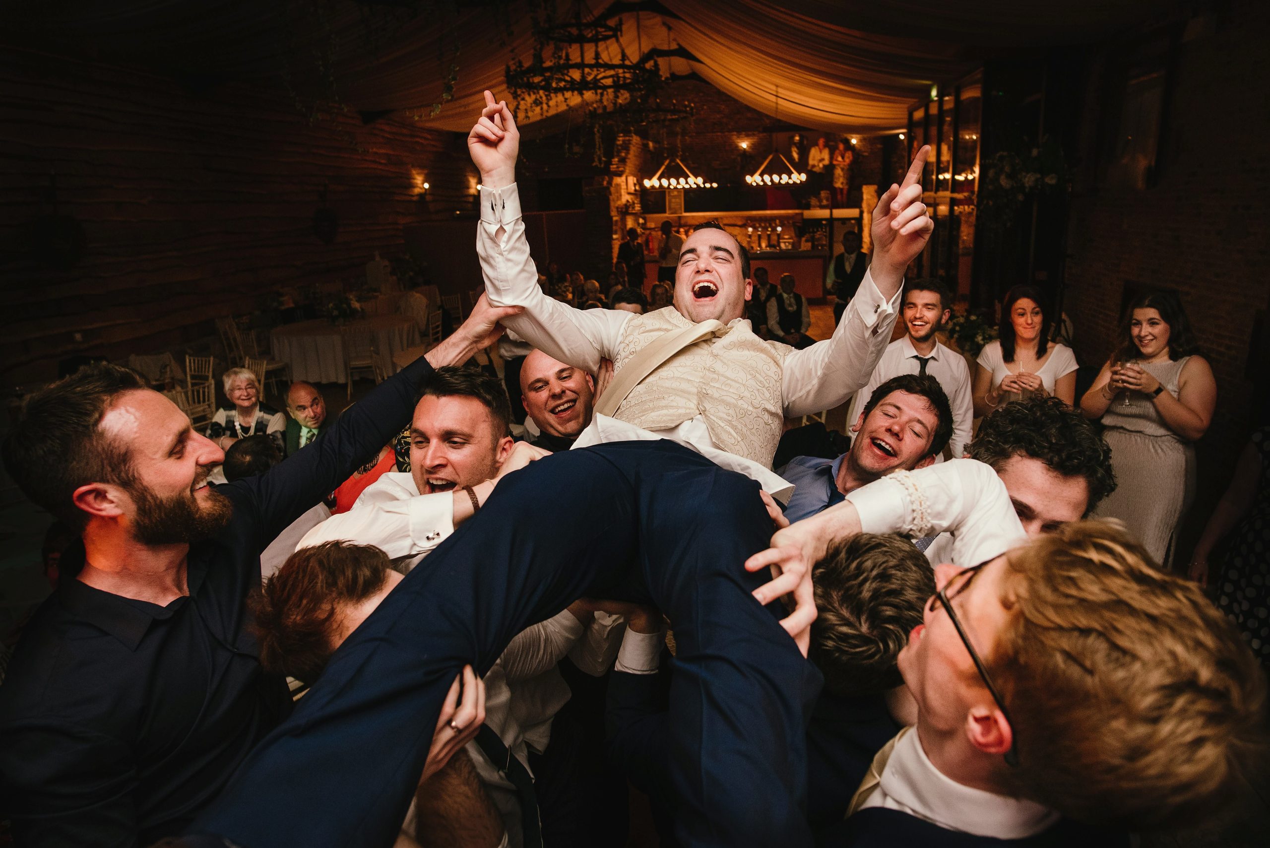 Groom crowd surfing yorkshire wedding photographer
