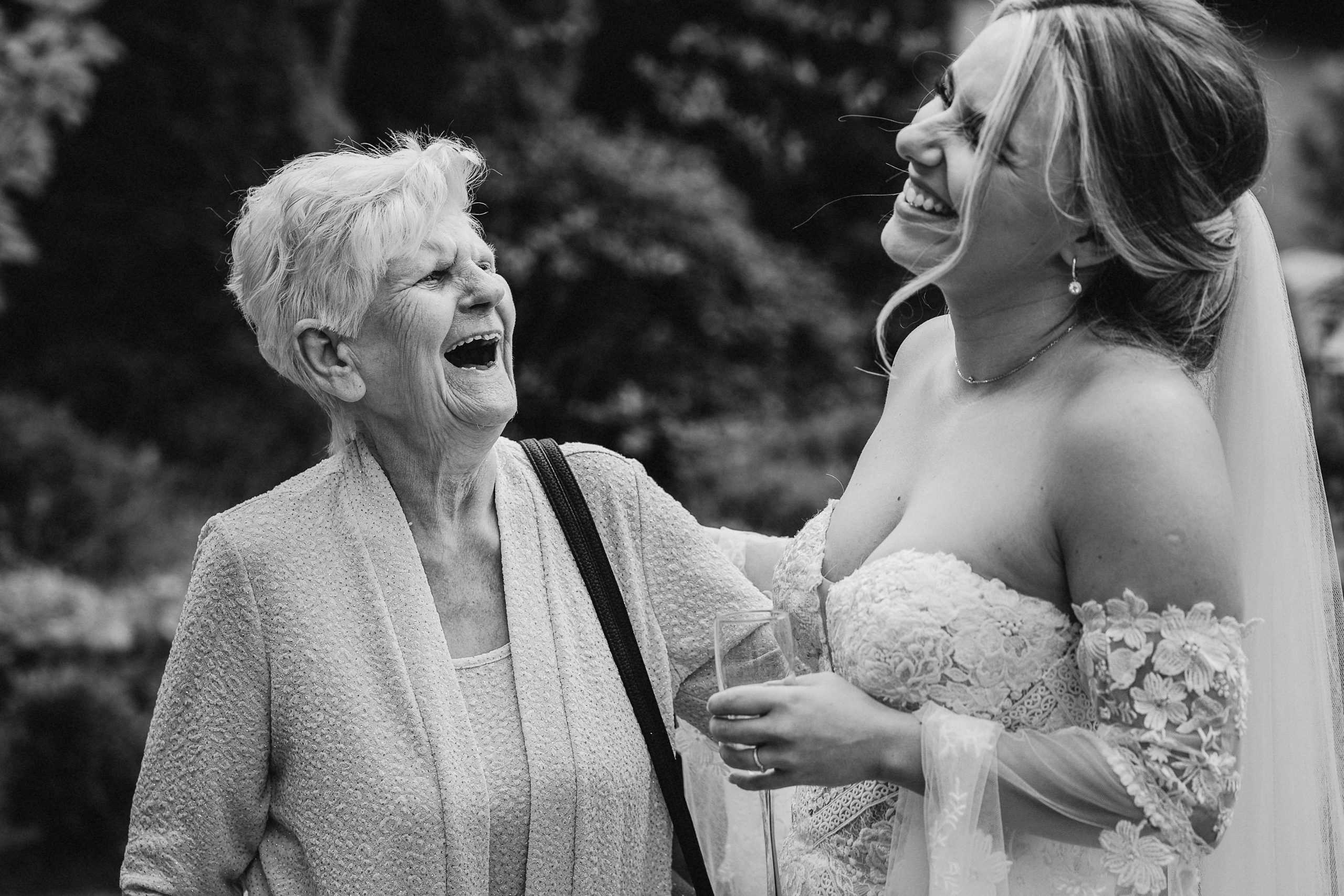 Bride laughing with grandma at yorkshire wedding