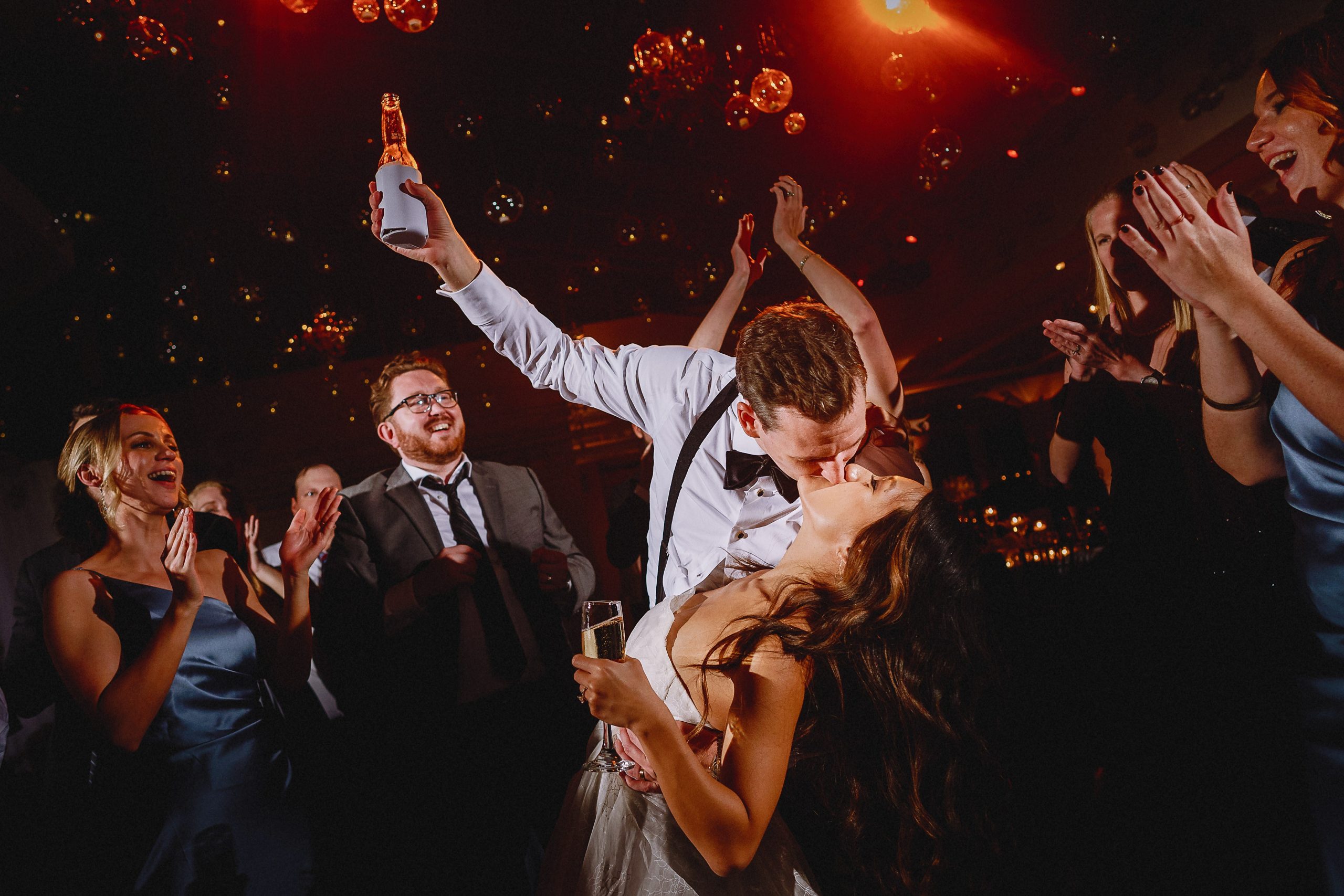 Bride and groom kiss on the dance floor - documentary wedding photography